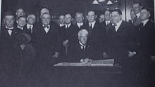 Judge Kenesaw Mountain Landis signs the agreement to become Commissioner of Baseball, November 12, 1920. Landis is hired.jpg