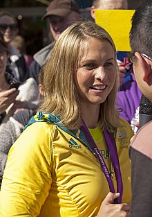 Libby Trickett being interviewed by the media at the Welcome Home parade in Sydney.jpg