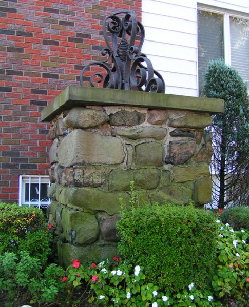 Massive stone pier outside a house in Dyker Heights