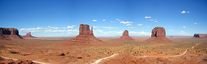 Panorama taken from the Visitor Center, showing the West and East Mitten Buttes and the road making a loop-tour through the Park
