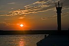 Sunset on estuary of the Rega river