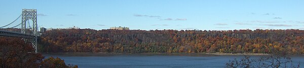 The Palisades, with fall foliage. On the left is the George Washington Bridge. A controversial plan to build a high-rise that would have broken the tr