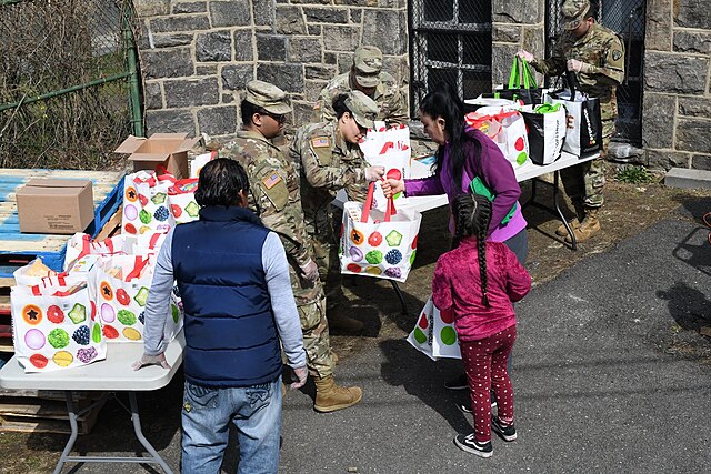 Members of the New York National Guard distribute groceries in New Rochelle on March 18, 2020