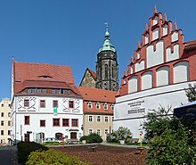 Renovated buildings in the old town of Pirna: View from Frohngasse to the Canaletto House (left), the tower of St. Mary's Church and the late Gothic ornamental gable of the German-Czech boarding school