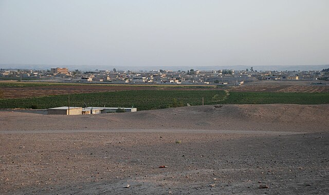 Tell Bi'a with Raqqa in the background