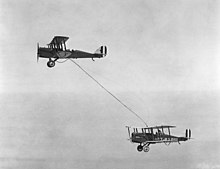 Capt. Lowell Smith, and Lts. John Richter, Virgil Hine, and Frank Seifert conduct first mid-air refueling, June 27, 1923 Refueling, 1923.jpg