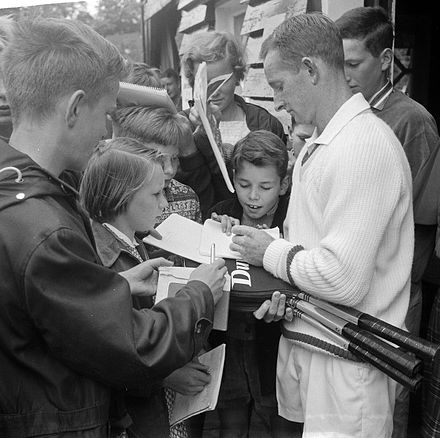 Rod Laver signing autographs at the Dutch Championships in July 1962