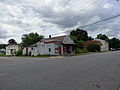 Rosie's Restaurant, a defunct eatery at the corner of Main Street (SR 92) and West Church Street in Clover, Virginia. South and east (front) sides of building shown.