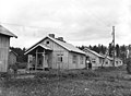 Shouman Suomi houses in Inkerinkylä with inhabitants.jpg