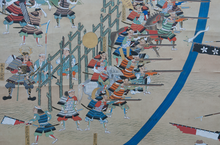 Detail of the Battle of Nagashino screen painting depicting arquebusiers of the Oda clan Six fold screen of The Battle of Nagashino.png