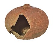 Broken money box in red earthenware (between 1250 and 1350), archaeological find from Bruges.