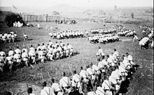 Spanish troops at mass honoring King Alfonso XIII on his birthday in the Moro town of Momungan (present-day Lanao del Norte Province), Mindanao on 17 May 1892. The presence of Spanish troops since the 16th century massively expanded on the island of Mindanao, threatening the Moros, especially with their Christianization mission. Spanish troops at mass honoring King Alfonso XIII birthday in Momungan (present-day Lanao del Norte Province), Mindanao Island.jpg