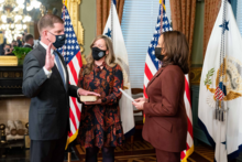 Walsh is sworn in as the new Secretary of the Department of Labor by Vice President Kamala Harris in March 2021, with his hand on a Bible being held by his longtime partner, Lorrie Higgins Swearing In of DOL Secretary Marty Walsh.png