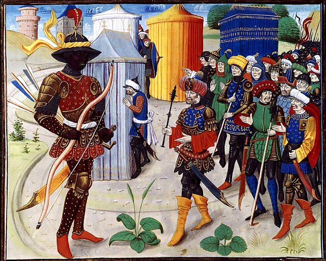 Vivien, as a Saracen emir, sends the black wizard Noiron to fight Maugis in the siege of Aigremont. Renaud de Montauban. Loyset Liédet, Bruges, 1462-1
