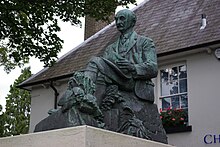 Statue of Thomas Hardy beside The Grove, north of High West Street