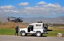 USN MH-53E lands supplies at Port-au-Prince 2010-01-16.jpg