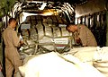 US Navy 051021-N-5863B-086 Sailors assigned to Fleet Logistics Support Squadron Six Four (VR-64), secure pallets of food, and re-building supplies donated by the government of The Arab Republic of Egypt.jpg
