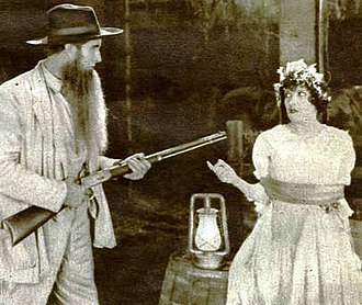 Gloria Swanson and unidentified actor (actually it's Russell Simpson) Under the Lash (1921) - 1.jpg