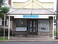 This property, at the corner of Platt and Ada, was once a corner store but is now a private residence. It is also a bus stop, and people waiting for the bus can use the roof for shelter.