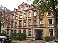 Apartment building in closed development with front garden