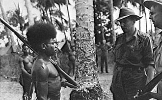 A member of the Papuan Constabulary with Brigadier Ivan Dougherty and an ANGAU warrant officer Yarawa of the Royal Papuan Constabulary.jpg