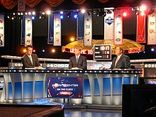 Gruden (center) at the 2011 NFL Draft with ESPN