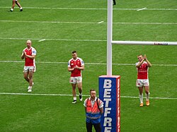 Dejected Hull Kingston Rovers players applaud their fans after their Golden Point loss at the 2023 Challenge Cup.