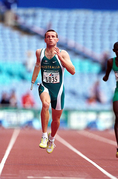 Action shot of Francis during his gold medal run in the 400 m T46 at the 2000 Summer Paralympic's