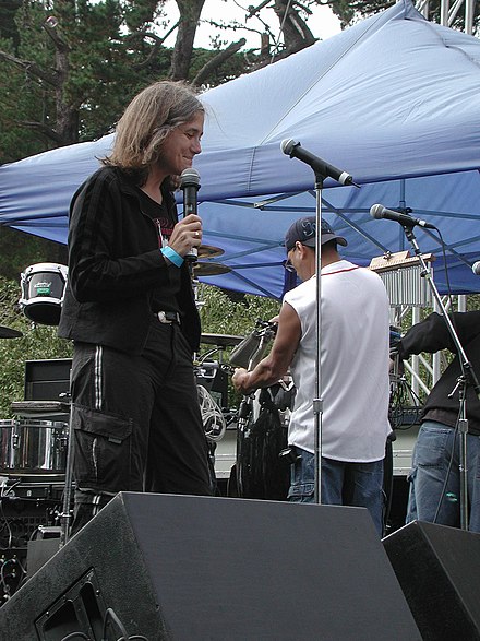 Goodman speaking at Power to the Peaceful Festival, San Francisco, 2004