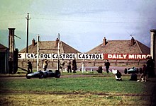 Dan Gurney in his Porsche passing Anchor Crossing Anchor Crossing, British Grand Prix, 1961 geograph-2741605-by-John-Goldsmith.jpg