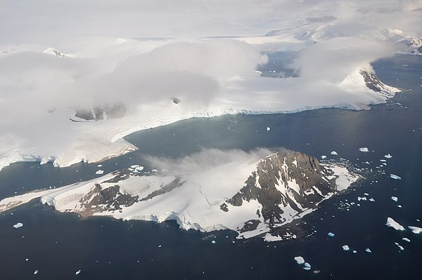 Off the coast of the Peninsula are numerous islands. Here is Webb Island and, behind it, Adelaide Island. See the image description page for a detaile