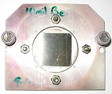 A square beryllium foil mounted in a steel case to be used as a window between a vacuum chamber and an X-ray microscope. Beryllium is highly transparent to X-rays owing to its low atomic number. Be foil square.jpg