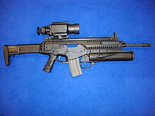 ARX160 equipped with a Qioptiq VIPIR thermal sight and GLX160 grenade launcher, and the bolt assembly in full rearward position Beretta AR with thermal sight and grenade launcher.jpg