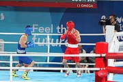 Deutsch: Boxen bei den Olympischen Jugendspielen 2018 Tag 12, 18. Oktober 2018 - Finale im Leichten Weltergewicht Jungen – Ilia Popov (Russland, rot) schlägt Talgat Shaiken (Kasachstan, blau) 4-1; Ringrichter ist James Beckles (Trinidad und Tobago). English: Boxing at the 2018 Summer Youth Olympics on 18 October 2018 – Final Light Welterweight Boys Bout - Ilia Popov (Rusia, rojo) supera a Talgat Shaiken (Kazajstán, azul) 4-1; Referee is James Beckles (Trinidad and Tobago). Español: Boxeo en los Juegos Olímpicos Juveniles de Verano de 2018 en 18 de octubre de 2018 - Chicos de peso welter ligero final: Ilia Popov (Uzbekistán, roja) le gana a Talgat Shaiken (Egipto, azul) 4-1; El árbitro es James Beckles (Trinidad y Tobago).