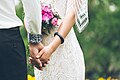 Bride and groom hold hands (Unsplash).jpg