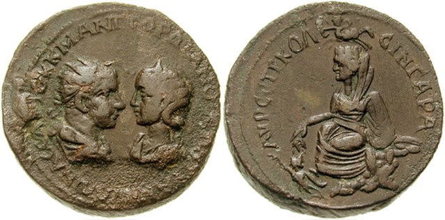 Tyche on the reverse of this base metal coin by Gordian III (r. 238 – 244 AD)