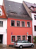 Residential house in closed development and side wing in the courtyard