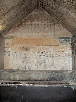 The burial chamber with protective spells filling the west gable, protecting the sarcophagus and its contents below. Burial chamber in Unas' pyramid.jpg