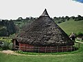 A reconstruction of an ancient roundhouse. The Moel y Gerddi roundhouse.