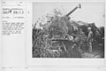 Camouflage - Artillery - No German airman comes near this well camouflaged anti-aircraft gun. It is well camouflaged to hide it from enemy aircraft and is so mounted that it can be swing into any position with ease - NARA - 20808910.jpg