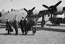 A mixed service and civilian crew of No. 45 Group RAF leave their Consolidated Liberator B Mark VI on arriving at Celone, Italy, after a ferry flight from Canada. Likely in the first months of 1944, as this is when 31 Squadron SAAF was re-equipping with Liberators. Consolidated B-24 Liberator - Royal Air Force Transport Command, 1943-1945. CNA2784.jpg