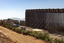 Replacement border fencing construction. California, 2019 Construction Continues on the Replacement Border Wall near the Tecate Port of Entry (48374319221).jpg