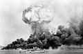 Image 46An oil storage tank explodes during the first Japanese air raid on Darwin on 19 February 1942 (from Military history of Australia during World War II)