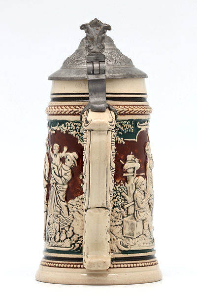 File:Faience beer stein with ball scene on brown background 05.jpg