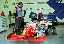 The Footwork FA16 during the 1995 British Grand Prix Footwork FA16 - Max Papis in the pit garage at the 1995 British GP, Silverstone (49712432836).jpg