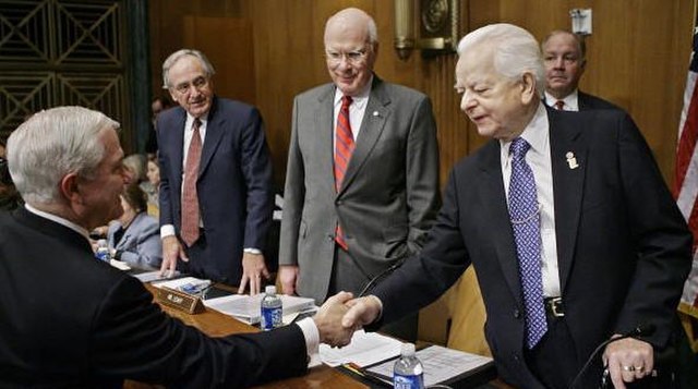 Former Committee Chairman Robert Byrd (D-WV, far right) shakes hands with Secretary of Defense Robert Gates while Sen. Patrick Leahy (D-VT, center rig