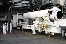 A GEM 60 solid rocket motor is seen laying horizontally on a trailer at Cape Canaveral's SLC-37B.