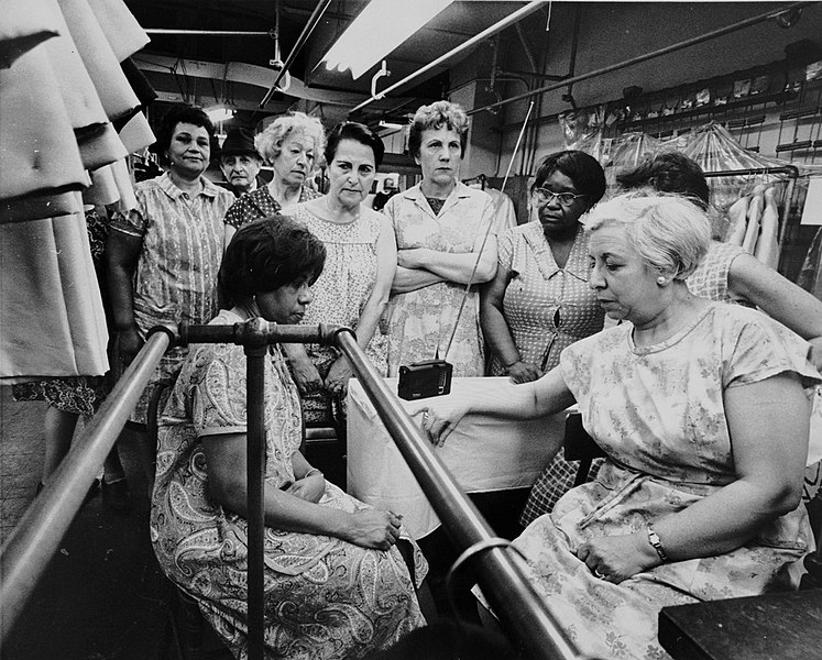 File:Garment workers listen to funeral service for MLK on portable radio April 8 1968.jpg