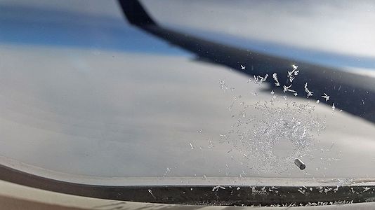 Ice on plane window