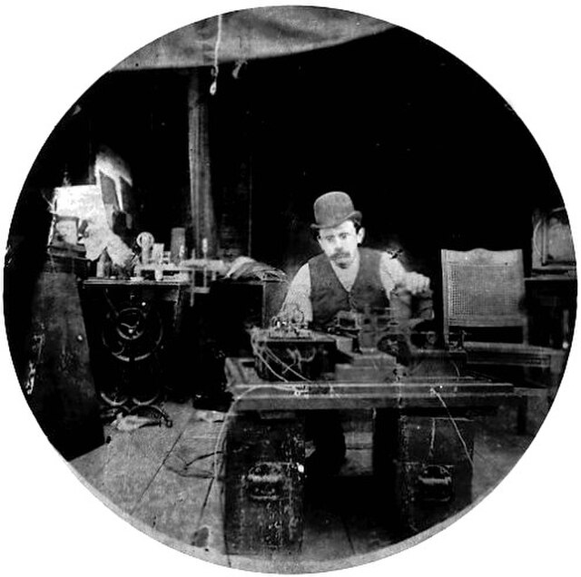 Charles Kayser of the Edison lab seated behind the Kinetograph. Portability was not among the camera's virtues.